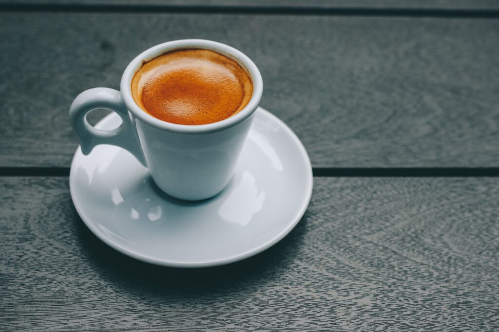 Fresh espresso with rich golden crema in a white cup